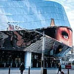 people walking near glass building during daytime